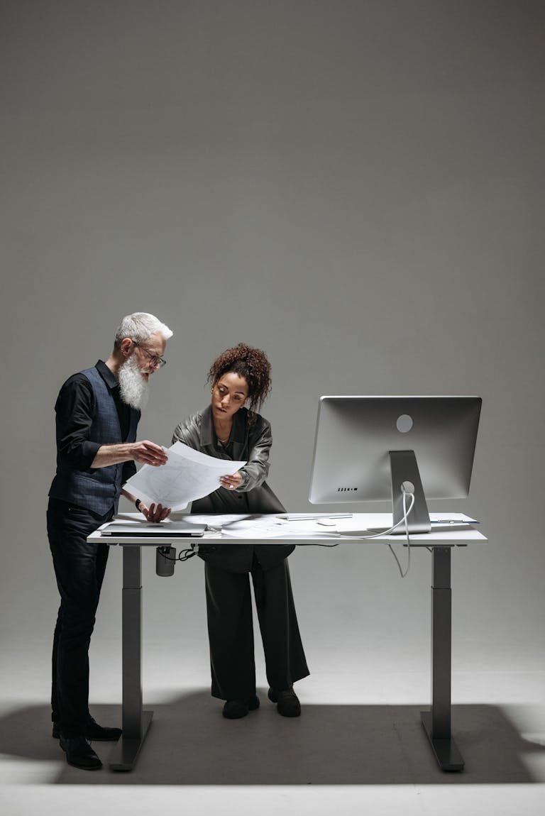 A Man and a Woman Looking at a Document